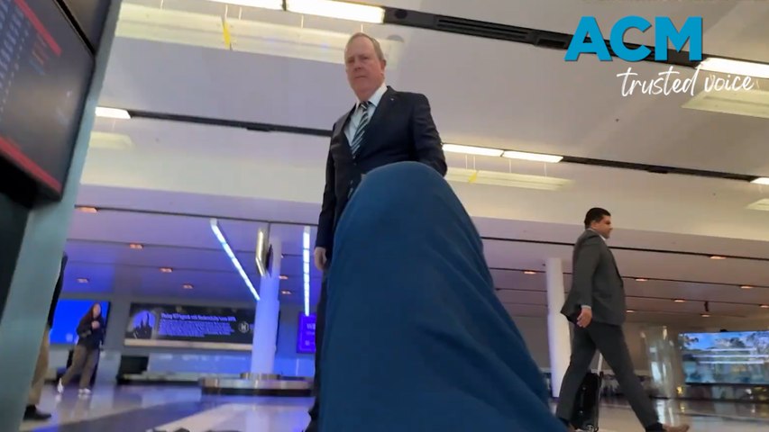 Journalist Liam Mendes from The Australian approached the former federal treasurer at Canberra Airport before the journalist appears to be knocked to the ground.