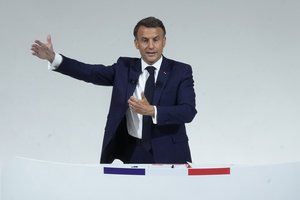 French President Emmanuel Macron answers questions after delivering a speech, Wednesday, June 12, 2024 in Paris. French President Emmanuel Macron called for moderate politicians from the left and the right to regroup to defeat the far-right in general elections. (AP Photo/Michel Euler)