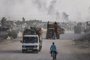 FILE - Palestinians fleeing from the southern Gaza city of Rafah during an Israeli ground and air offensive in the city, May 28, 2024.