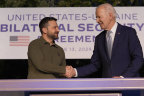 President Joe Biden and Ukrainian President Volodymyr Zelenskyy shake hands.