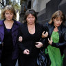 Dawn Waite (centre) is helped by friends leaving court after an emotional afternoon giving evidence.