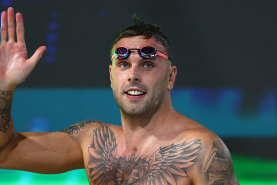 Kyle Chalmers waves to the crowd after his 100m freestyle win on Thursday evening. 