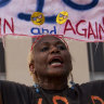 Nadine Seiler protest as she holds a banner outside federal court in April last year.