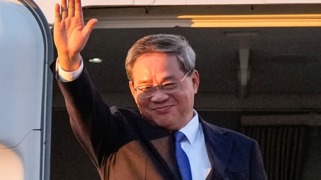 China’s Premier Li Qiang waves as he arrives at Adelaide Airport on June 15, 2024 in Adelaide.