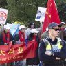 Protestors and supporters of Chinese Premier Li Qiang at the entrance of Adelaide Zoo ahead of a visit from Chinese Premier Li Qiang.