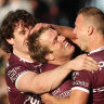 Jake Trbojevic and Daly Cherry-Evans celebrate a try against the Dragons on Sunday.