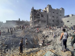 FILE - Palestinians inspect the damage of buildings destroyed by Israeli airstrikes on Jabaliya refugee camp on the outskirts of Gaza City, Tuesday, Oct. 31, 2023. Jabaliya refugee camp was one of Gaza’s most densely populated areas and has been struck multiple times since Oct. 7. The true toll remains unknown because many remain under the rubble.