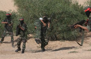 Militants with the Democratic Front for the Liberation of Palestine (DFLP) take part in a military training session, May 19, 2011, in the southern Gaza Strip town of Khan Yunis.(Photo By ahmed Deeb/wn)