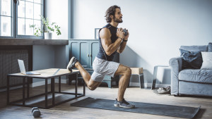 Young men at home exercising. 