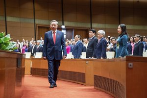 To Lam walks to the podium to swear in as the president at the National Assembly in Hanoi, Vietnam