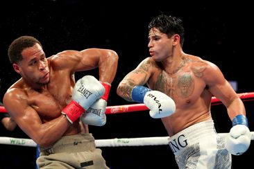 Ryan Garcia throws a punch at Devin Haney.