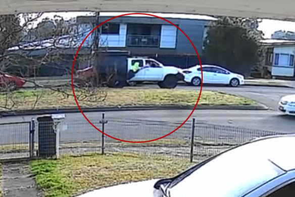 CCTV shows the victim of the alleged road rage incident being dragged down the road.