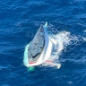 Two men were rescued from a capsized yacht off the coast of Bundaberg on Sunday.