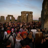 People gather in the centre of Stonehenge.