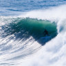 A surfer riding a wave at Dead Man’s