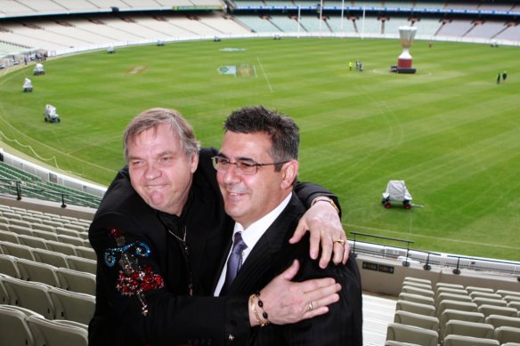 Former AFL CEO with performer Meat Loaf ahead of the 2011 grand final.