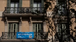 A banner reading ‘For Rent’ hangs from the balcony of a residential apartment near Plaza Catalunya in Barcelona.