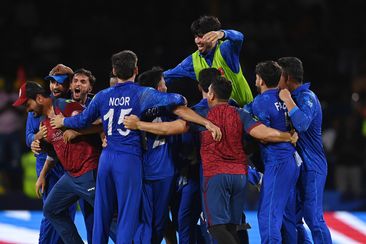 Afghanistan players celebrate winning the ICC Men&#x27;s T20 Cricket World Cup West Indies &amp; USA 2024 Super Eight match between Afghanistan and Australia at Arnos Vale Ground on June 22, 2024 in St Vincent, Saint Vincent and The Grenadines. (Photo by Gareth Copley/Getty Images)