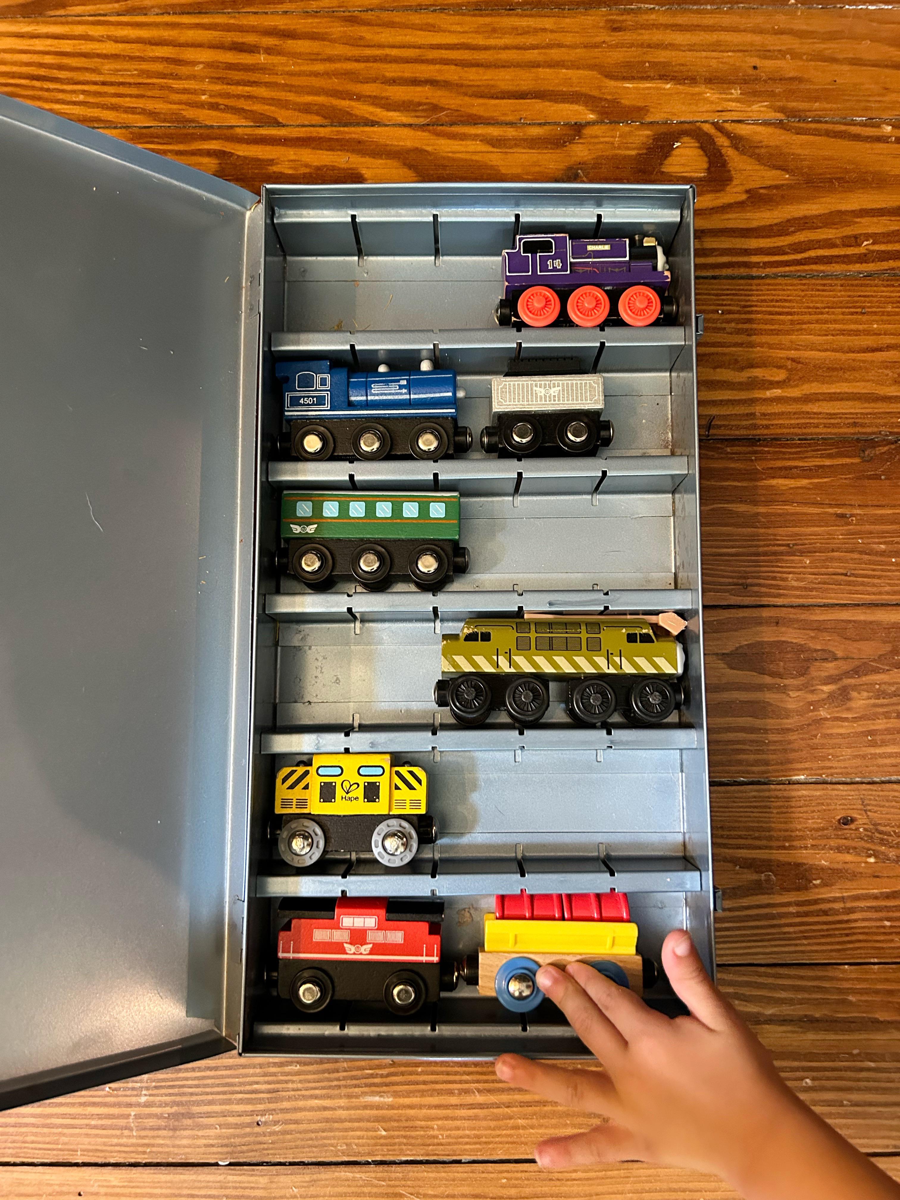 r/oddlysatisfying - My son’s trains fit perfectly in my grandma’s old slide box