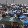 Muslim pilgrims use umbrellas to shield themselves from the sun.