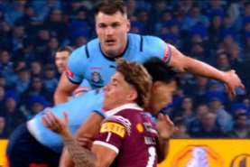 Screengrab of State of Origin 2 promotion showing Reece Walsh being taken out by Joseph Suaalii in game 1 in Sydney.