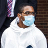 Tyrese Haspil, 21, is escorted out of the 7th precinct by NYPD detectives on Friday, July 17.