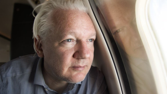 Julian Assange on board the plane that took him from Britain to Bangkok.