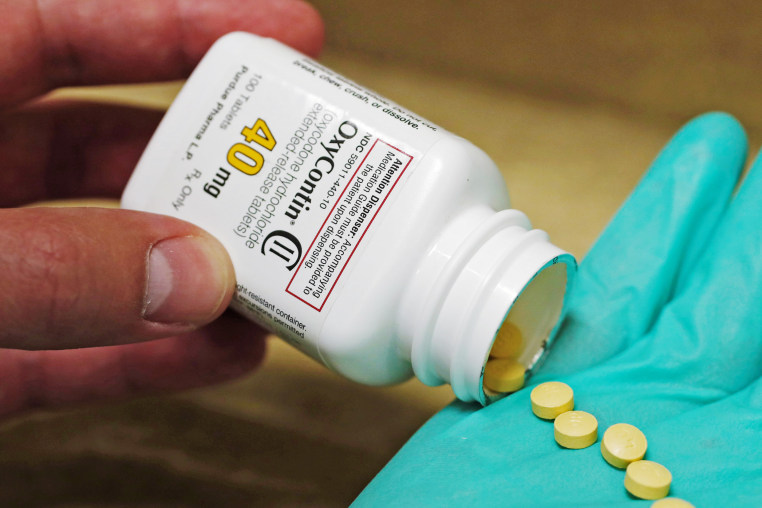 A pharmacist holds prescription painkiller OxyContin, 40mg pills, made by Purdue Pharma L.D. at a local pharmacyA pharmacist holds prescription painkiller OxyContin, 40mg pills, made by Purdue Pharma L.D. at a local pharmacy, in Provo, Utah, U.S., April 25, 2017. 