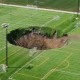 Aerial view showing massive sinkhole on a soccer field in Alton, Illinois.