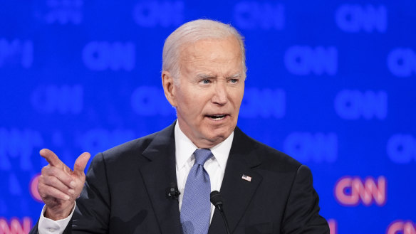 Presient Joe Biden points to Donald Trump during the first part of the presidential event.