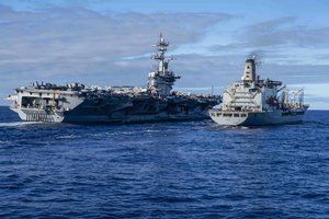 PACIFIC OCEAN (Jan. 15, 2022) USS Abraham Lincoln (CVN 72) transits alongside the Military Sealift Command fleet replenishment oiler USNS Guadalupe (T-AO 200) during a replenishment-at-sea. The Abraham Lincoln Carrier Strike Group, led by Carrier Strike Group 3, deployed from San Diego, Jan. 3, in support of global maritime security operations.