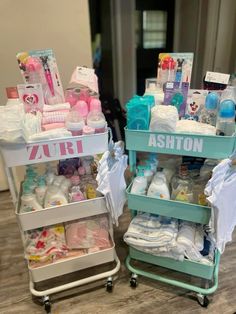 two trolleys filled with baby items on top of a wooden floor next to each other