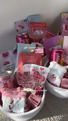 the basket is full of pink items for baby's first birthday