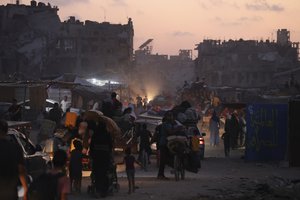 Palestinians displaced by the Israeli air and ground offensive on the Gaza Strip flee from parts of Khan Younis following an evacuation order by the Israeli army to leave the eastern part of Gaza Strip's second largest city on Monday, July 1, 2024.