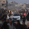 Palestinians flee parts of Khan Younis after an Israeli evacuation order.