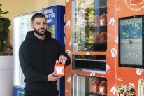 Cake Mail founder Jonathan Mussaad at his new Chatswood vending machine.