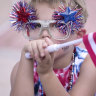 Sam Becker, 7, watches the annual South Montgomery County 4th of July Parade in The Woodlands, Texas