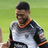 Stefano Utoikamanu stretches out at Wests Tigers’ training on Friday.