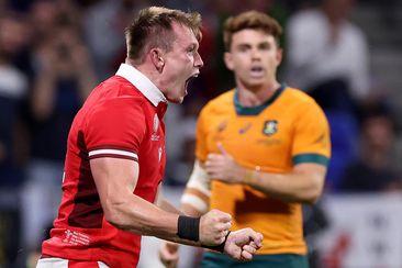 Nick Tompkins of Wales celebrates scoring his team&#x27;s second try during the Rugby World Cup in Lyon.