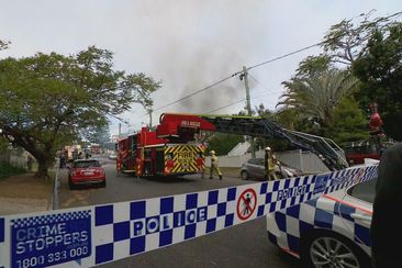 A monster fire that tore through three homes in Brisbane has left three people in hospital, including two firefighters. Residents of Evelyn Street at The Grange were on edge for hours as the flames spread and crews battled to save neighbouring properties