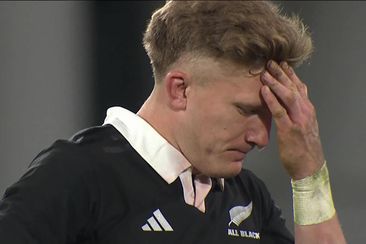 Damien McKenzie reacts after failing to take the penalty kick in time.