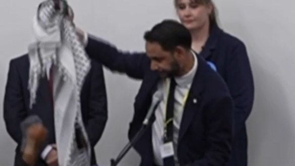 Leicester South MP winner Independent candidate Shockat Adam holds up the Palestinian keffiyeh as he celebrates. “This is for Gaza.”