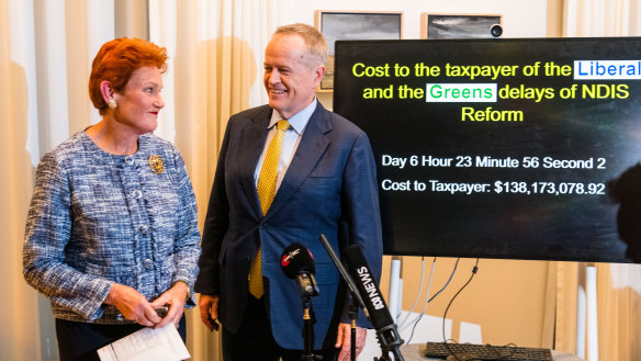 An unusual pairing … Pauline Hanson with Bill Shorten in his ministerial office.