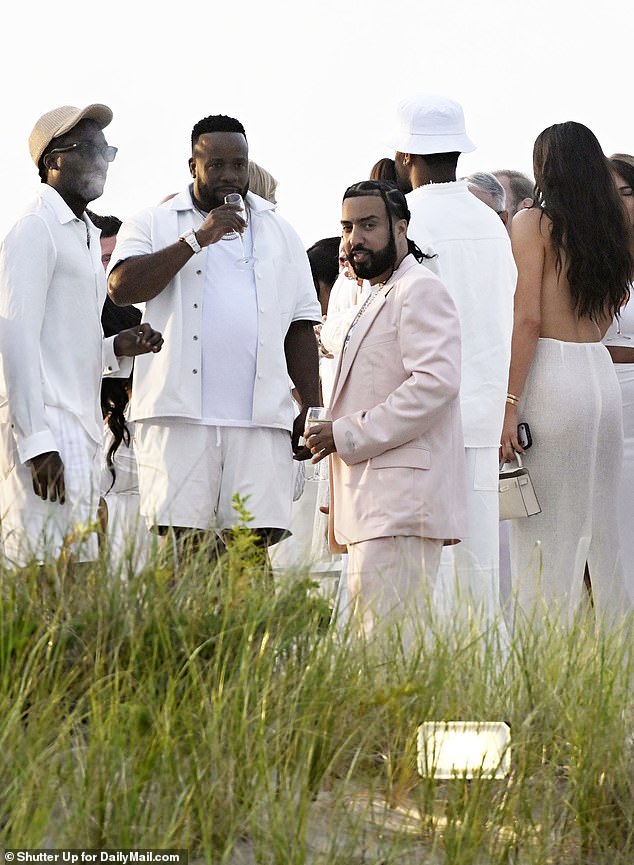 Rapper French Montana appeared to deviate from the dress code slightly, wearing a white-pink suit