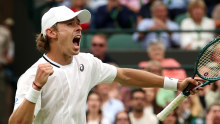 Alex de Minaur celebrates after beating Arthur Fils of France in the fourth round.