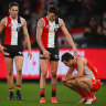 Double trouble: Josh Battle consoles Sydney’s Logan McDonald after St Kilda’s upset win.