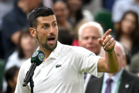 Novak Djokovic addresses the crowd on centre court.