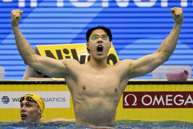 Qin Haiyang celebrates his 2023 world championship win against Australia’s Zac Stubblety-Cook in the men’s 200m breaststroke.