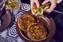 Filled flatbreads with kale and potato masala.