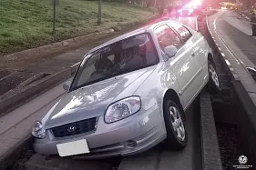 Elderly driver wedges car on bus track